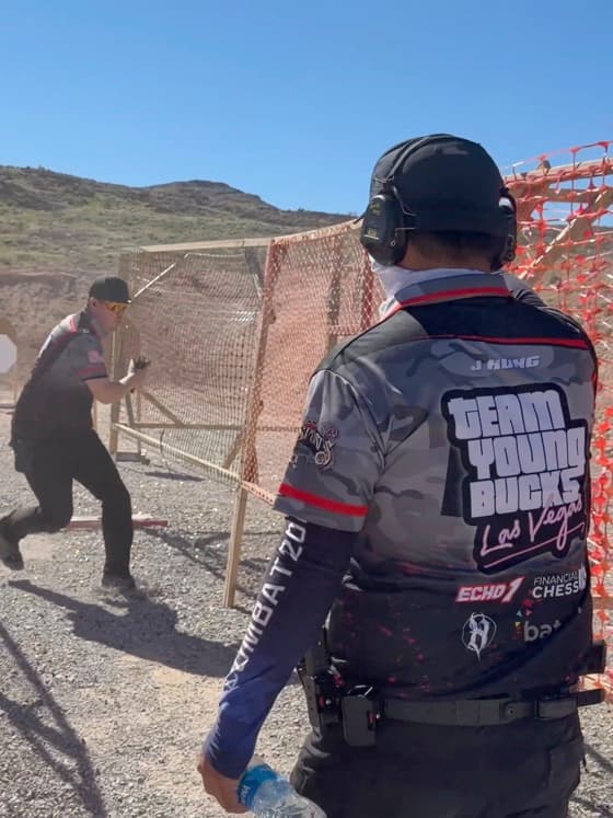 Range officer watching a competitor run a stage